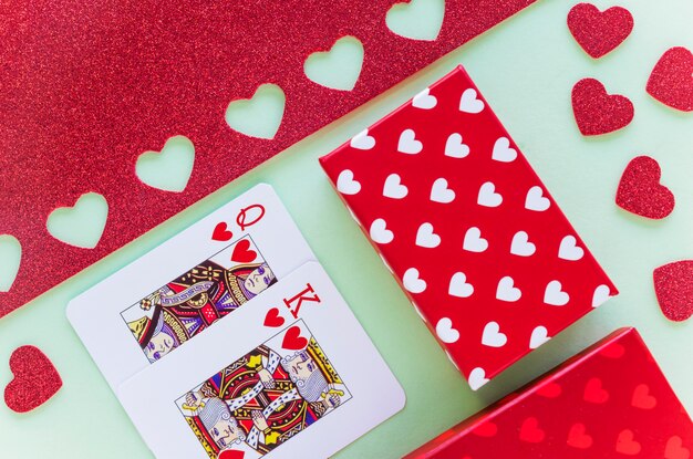 King and queen of hearts playing cards with gift box 