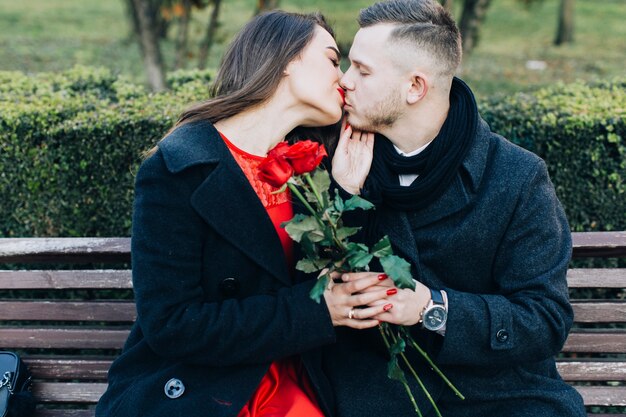 Kissing gentle couple having date