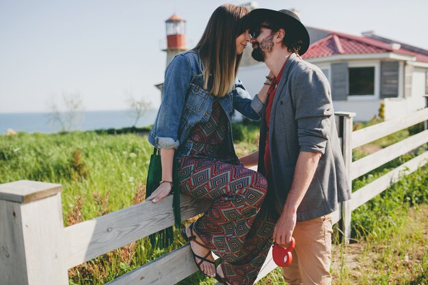 Kissing happy young stylish hipster couple in love kissing