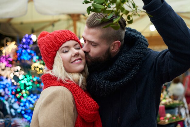 Kissing under the mistletoe is a tradition