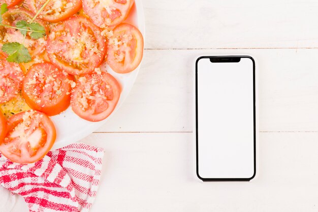 Kitchen desk with tomatoes plate and mobile