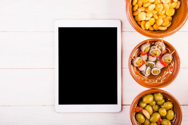 Kitchen desktop with tablet and snack plates