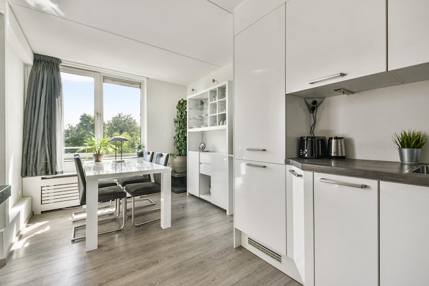 Free photo kitchen and the dining room of a modern apartment