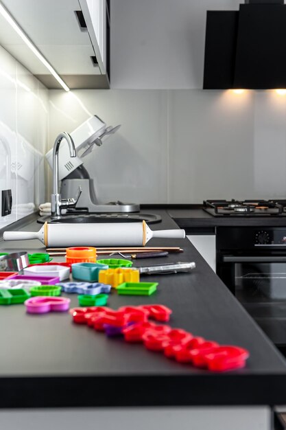 Kitchen interior with cookie cutters cooking cookies