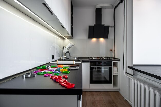 Kitchen interior with cookie cutters cooking cookies