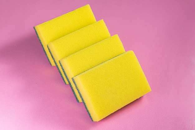 Kitchen sponge on the pink background