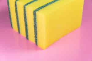 Free photo kitchen sponge on the pink background