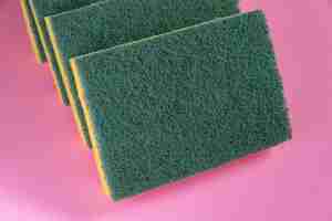 Free photo kitchen sponge on the pink background