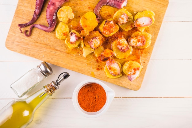 Kitchen table with chopping board with seafood