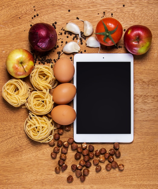 Free photo kitchen. tablet and food