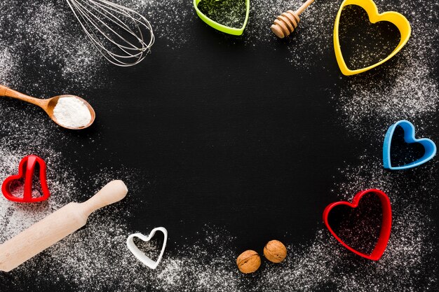 Kitchen utensils and heart shapes frame