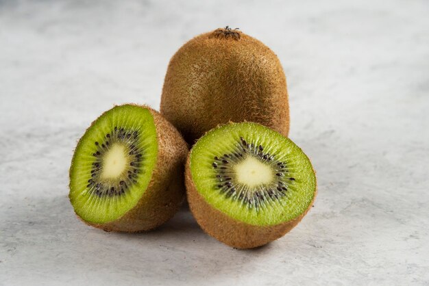 Kiwi sliced pieces on white. 