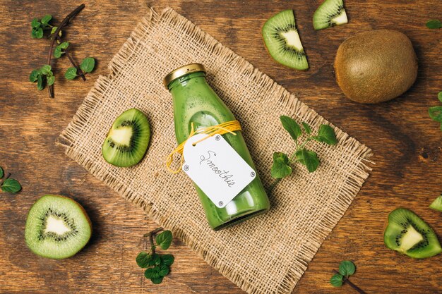 Kiwi smoothie on wooden table