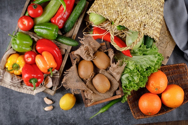 Kiwies, oranges and colorful bell peppers.