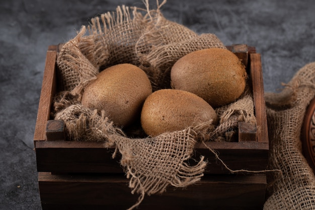 Kiwies in a wooden small tray.