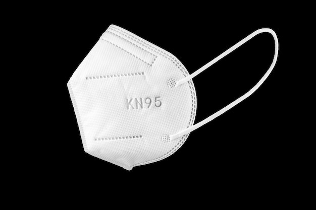 Kn95 face mask isolated on black background. personal protective equipment against coronavirus covid-19