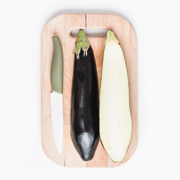 Knife and eggplant on cutting board