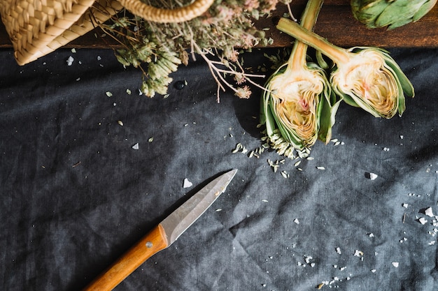 Knife near cut artichoke