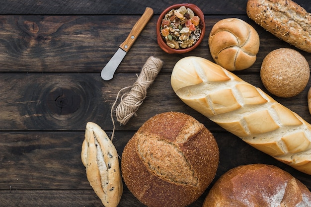 Knife and rope near fresh bread