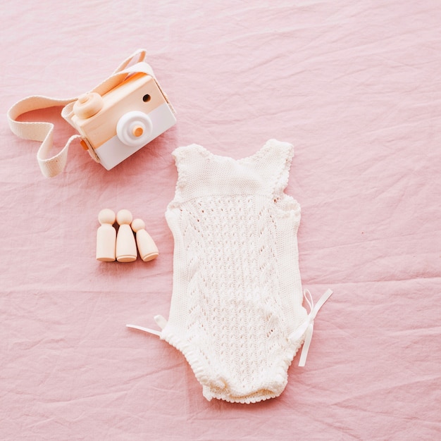 Knitted baby romper and toy camera