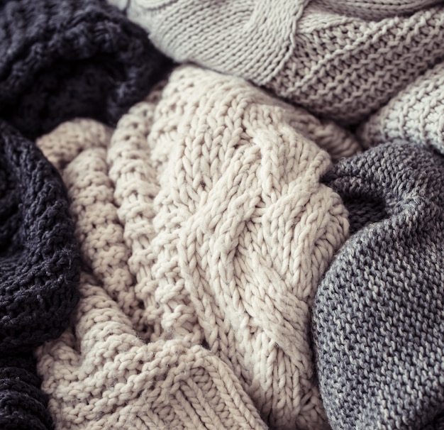 Knitted sweater on a wooden background