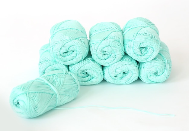 Knitting, close-up. Blue threads on the table