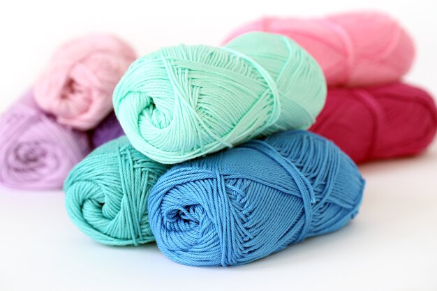 Knitting, close-up. Colorful threads on the table