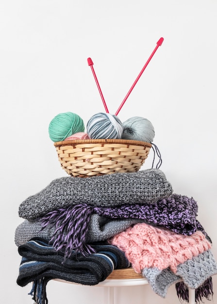 Knitting needles and wool in basket