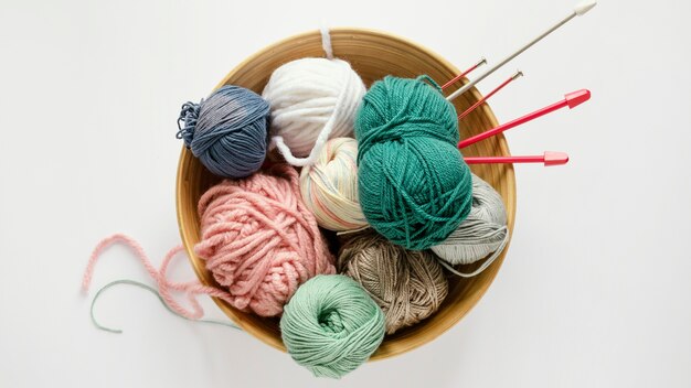 Knitting needles and wool in basket