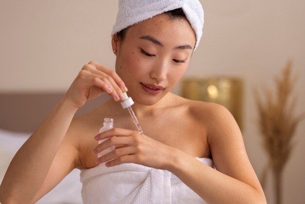 Free photo korean woman doing skincare