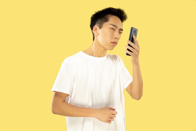 Korean young man's half-length portrait on yellow wall