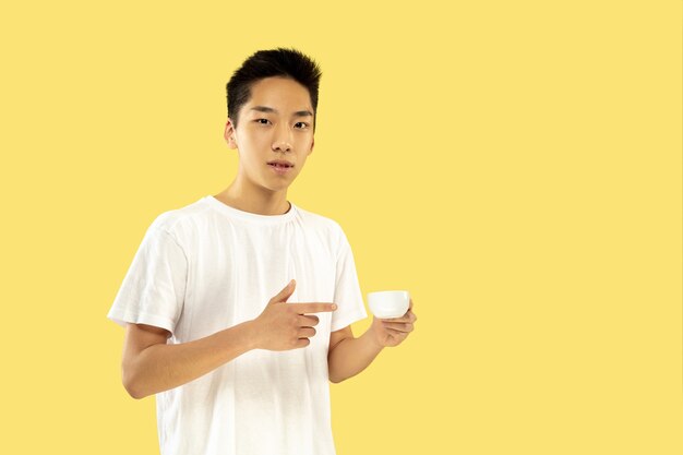 Korean young man's half-length portrait on yellow