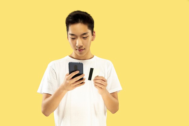 Korean young man's half-length portrait on yellow