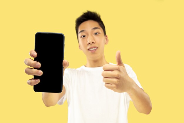 Korean young man's half-length portrait on yellow