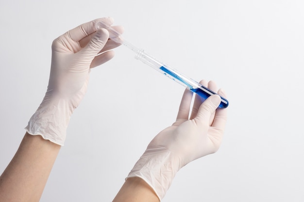 Lab doctor performing medical exam of urine