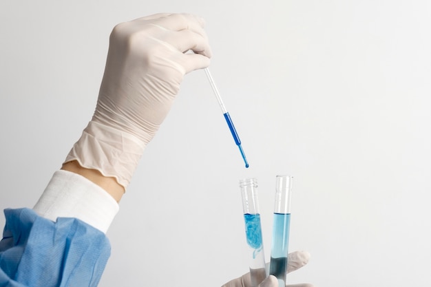 Lab doctor performing medical exam of urine