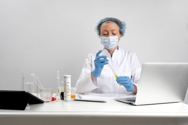 Free photo lab doctor performing medical exam of urine