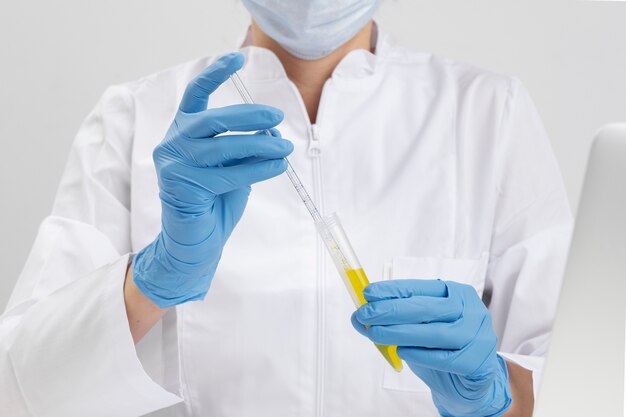 Lab doctor performing medical exam of urine