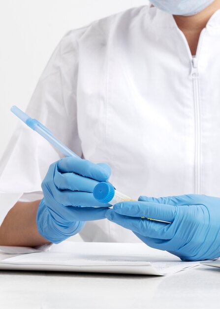 Lab doctor performing medical exam of urine