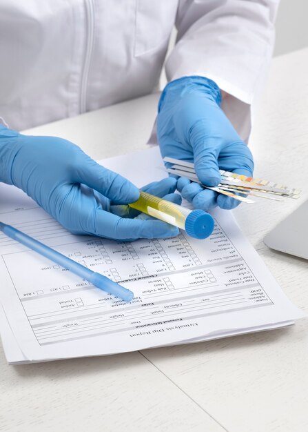 Lab doctor performing medical exam of urine