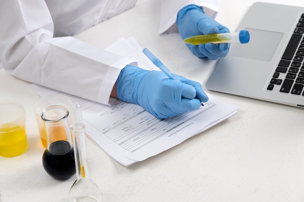 Free photo lab doctor performing medical exam of urine