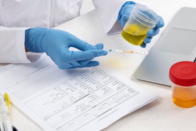 Lab doctor performing medical exam of urine