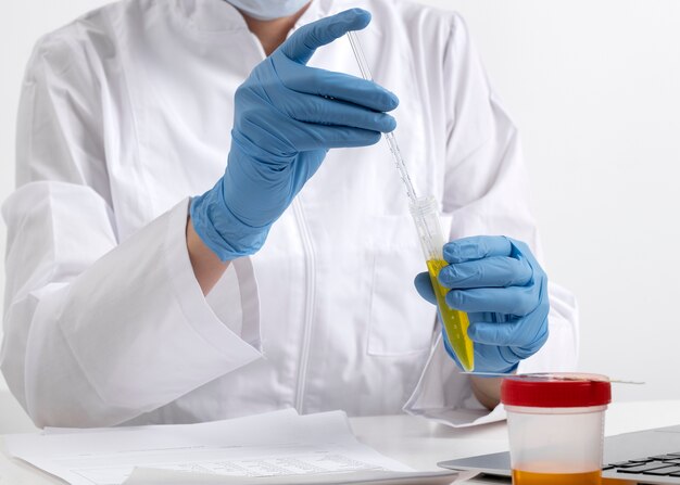 Lab doctor performing medical exam of urine