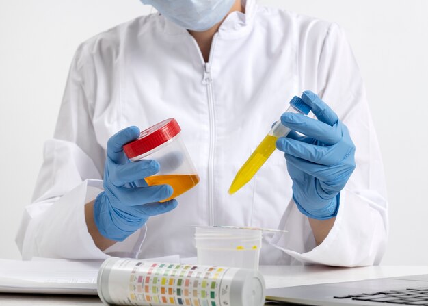 Lab doctor performing medical exam of urine