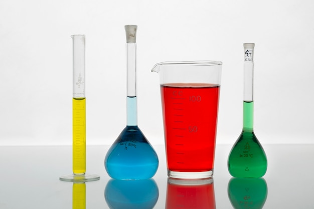 Lab glassware containing colored liquids