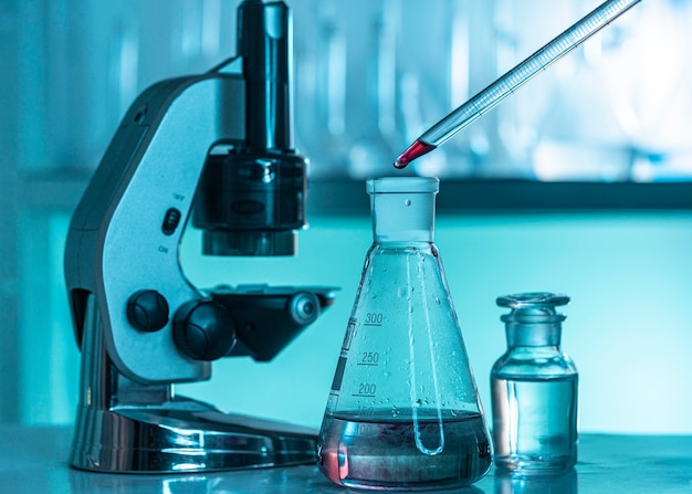 Lab glassware and microscope arrangement