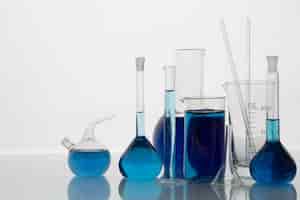 Free photo lab glassware with blue liquid still life