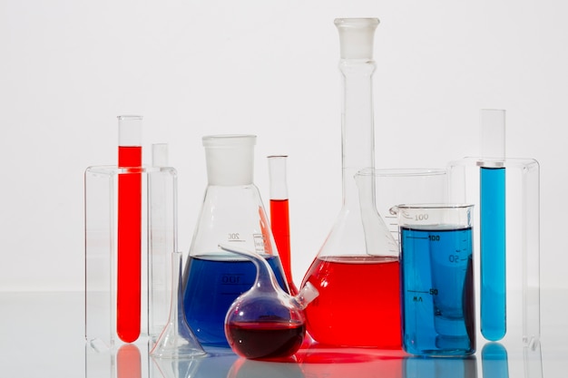 Lab glassware with blue and red liquid assortment