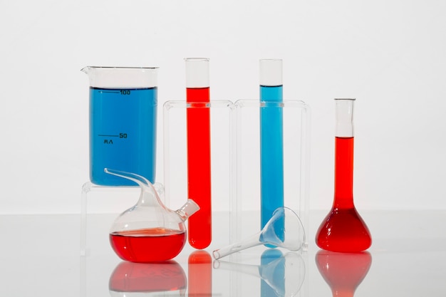 Lab glassware with blue and red liquids