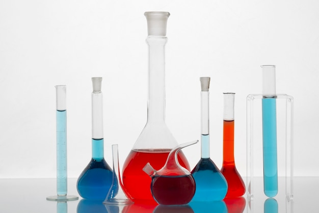 Lab glassware with colored substance arrangement